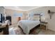 Bright bedroom featuring a comfortable bed, neutral walls, and natural light from two windows with blinds at 5501 80Th N St # 201, St Petersburg, FL 33709