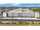 Spacious condominium featuring lush landscaping, assigned covered parking and desirable curb appeal at 5501 80Th N St # 201, St Petersburg, FL 33709