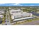 Aerial view highlighting a multi-story residential complex with covered parking and landscaping at 5501 80Th N St # 201, St Petersburg, FL 33709