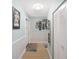 Light and bright hallway leading into the unit featuring ample closet space at 5501 80Th N St # 201, St Petersburg, FL 33709