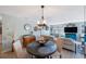 Inviting living room with a round dining table, neutral-toned furniture, and stylish decor at 5501 80Th N St # 201, St Petersburg, FL 33709