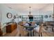 Bright and open living room with modern decor, comfortable seating, and a dining area in the foreground at 5501 80Th N St # 201, St Petersburg, FL 33709