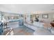 Bright living room featuring an adjacent dining area and comfortable seating at 5501 80Th N St # 201, St Petersburg, FL 33709