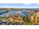 Overhead shot of a community building with stunning water views and beautiful landscaping at 606 Riviera Dunes Way # 207, Palmetto, FL 34221