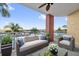 Comfortable outdoor balcony with seating and beautiful marina views at 606 Riviera Dunes Way # 207, Palmetto, FL 34221