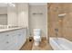 Bathroom featuring a shower/tub combo, vanity with storage, and toilet at 606 Riviera Dunes Way # 207, Palmetto, FL 34221