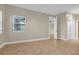 The primary bedroom includes tile floors, a window, and an ensuite bathroom at 606 Riviera Dunes Way # 207, Palmetto, FL 34221