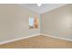 Bright bedroom featuring neutral paint, tile flooring and window for natural light at 606 Riviera Dunes Way # 207, Palmetto, FL 34221