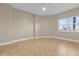 Bright bedroom featuring neutral paint, tile flooring and window for natural light at 606 Riviera Dunes Way # 207, Palmetto, FL 34221