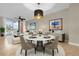 Elegant dining area with modern decor and ample natural light at 606 Riviera Dunes Way # 207, Palmetto, FL 34221