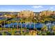 Scenic view of a waterfront community featuring a large pond with fountain and manicured grounds at 606 Riviera Dunes Way # 207, Palmetto, FL 34221