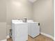 Bright laundry room features a white washer and dryer for convenient chores at 606 Riviera Dunes Way # 207, Palmetto, FL 34221