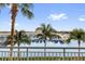 Stunning views of the marina and palm trees are seen from the balcony at 606 Riviera Dunes Way # 207, Palmetto, FL 34221