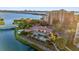 Scenic pool area with tropical landscaping and waterfront views at 606 Riviera Dunes Way # 207, Palmetto, FL 34221