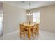 Dining space with a wooden table and chandelier, offering a comfortable place to eat at 3108 Magnolia Garden Dr, Plant City, FL 33567