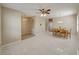 Bright dining area with tile flooring, an arched feature, and a view into other rooms at 3108 Magnolia Garden Dr, Plant City, FL 33567