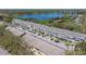 Picturesque aerial view highlighting a vibrant community set against the backdrop of a tranquil lake at 2210 Utopian E Dr # 314, Clearwater, FL 33763