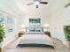 Inviting bedroom with a large window, stylish decor, and ample space, creating a relaxing atmosphere at 2210 Utopian E Dr # 314, Clearwater, FL 33763