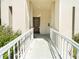 Exterior entranceway with ramp, railings and tile floor at 2210 Utopian E Dr # 314, Clearwater, FL 33763