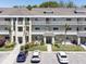 Beautiful condo exterior showcasing well-manicured landscaping and accessible parking at 2210 Utopian E Dr # 314, Clearwater, FL 33763