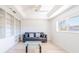 Bright living room featuring built-in bookshelves, modern furniture, and a large window at 2210 Utopian E Dr # 314, Clearwater, FL 33763