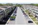 Street view of condos with mature landscaping and multiple parking spaces at 2210 Utopian E Dr # 314, Clearwater, FL 33763