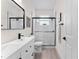 Bathroom showcasing black fixtures, a glass shower, and modern design at 2503 Dumont Ln, North Port, FL 34286
