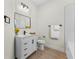 Stylish bathroom featuring a white vanity, modern fixtures, and a minimalist design with a clean aesthetic at 2503 Dumont Ln, North Port, FL 34286