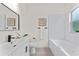 Clean bathroom featuring modern fixtures, white tiling in shower and bathtub at 2503 Dumont Ln, North Port, FL 34286