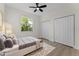 Bedroom featuring luxury vinyl floors, large window view of the outdoors, and double closet at 2503 Dumont Ln, North Port, FL 34286