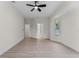 Bright and airy bedroom offers neutral tones, multiple doorways, and a large window at 2503 Dumont Ln, North Port, FL 34286
