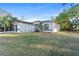 Charming single-story home featuring a stucco exterior, well-maintained lawn and attached garage at 2503 Dumont Ln, North Port, FL 34286