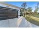 Close-up view of the garage featuring the address and a well-maintained driveway at 2503 Dumont Ln, North Port, FL 34286