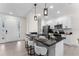 Stylish kitchen features black countertops, modern appliances, and a breakfast bar with seating at 2503 Dumont Ln, North Port, FL 34286