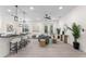 Bright living room with an open floor plan, showcasing the bar seating, stylish furniture, and natural lighting at 2503 Dumont Ln, North Port, FL 34286