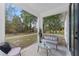 Inviting screened patio with stylish seating, offering a tranquil outdoor space with views of lush greenery at 2503 Dumont Ln, North Port, FL 34286