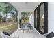 Cozy screened patio with comfortable seating, perfect for enjoying serene views and outdoor relaxation at 2503 Dumont Ln, North Port, FL 34286