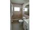 The bathroom has tile features, toilet, bathtub, sink and vanity with storage at 3708 97Th N Ave # 3, Pinellas Park, FL 33782