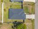 Drone shot of property featuring a well-maintained yard, roof, and driveway showcasing layout and surroundings at 2723 Jollivette Rd, North Port, FL 34288