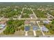 Aerial view of a neighborhood featuring well-maintained homes and lush landscaping, showcasing community and surroundings at 2723 Jollivette Rd, North Port, FL 34288
