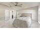 Spacious bedroom with tile floors, a vaulted ceiling, and a comfortable bed at 2723 Jollivette Rd, North Port, FL 34288