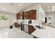 Updated kitchen featuring custom wood cabinets, stainless appliances, and gorgeous countertop at 2723 Jollivette Rd, North Port, FL 34288