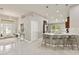 Bright kitchen with a quartz island, stainless steel appliances, and lovely lighting at 2723 Jollivette Rd, North Port, FL 34288