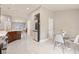 Spacious kitchen featuring modern stainless appliances adjacent to a dining area at 2723 Jollivette Rd, North Port, FL 34288
