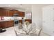 The kitchen is open to the dining area with modern wood cabinets, stainless appliances at 2723 Jollivette Rd, North Port, FL 34288