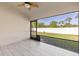 Screened patio with ceiling fan overlooks the backyard and has a tile floor, providing an outdoor living space at 2723 Jollivette Rd, North Port, FL 34288