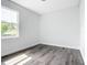 Bedroom with natural light, neutral walls, and sleek floors creates a relaxing atmosphere at 17041 Malta Ave, Port Charlotte, FL 33954