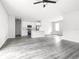 Open-concept floor plan with sleek floors connecting living, dining, and kitchen areas creates a modern feel at 17041 Malta Ave, Port Charlotte, FL 33954