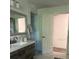 This bathroom boasts a modern vanity, and a view into the glass shower enclosure at 355 Highland Shores Dr, Ellenton, FL 34222