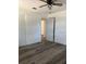Bedroom with hardwood floors, white doors, and modern ceiling fan at 355 Highland Shores Dr, Ellenton, FL 34222